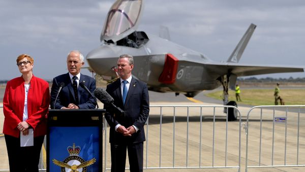 Australian Prime Minister Malcolm Turnbull speaks next to Minister for Defence, Senator Marise Payne and Minister for Defence Industry, Christopher Payne. Australian Prime Minister Malcolm Turnbull speaks next to Minister for Defence, Senator Marise Payne and Minister for Defence Industry, Christopher Payne. - Sputnik International