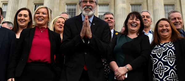 Sinn Fein President Gerry Adams gestures as he and Sinn Fein leader Michelle O'Neill introduce the new Sinn Fein Assembly team at Parliament buildings in Belfast, Northern Ireland March 6, 2017. Sinn Fein President Gerry Adams gestures as he and Sinn Fein leader Michelle O'Neill introduce the new Sinn Fein Assembly team at Parliament buildings in Belfast, Northern Ireland March 6, 2017. - Sputnik International