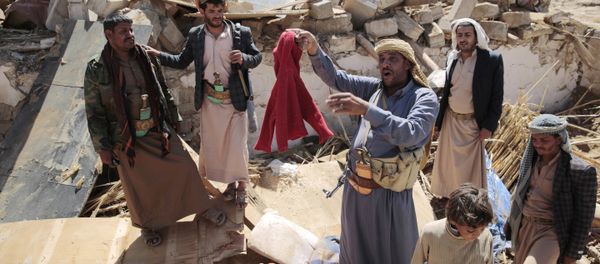 A man center, holds house destroyed by a Saudi-led airstrikes in outskirts of Sanaa, Yemen, Thursday, Feb. 16, 2017. A man center, holds house destroyed by a Saudi-led airstrikes in outskirts of Sanaa, Yemen, Thursday, Feb. 16, 2017. - Sputnik International