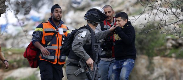 An Israeli border policeman arrests a young boy during clashes, following a protest over the death of Palestinian militant Basil al-Araj by Israeli forces early Monday, in front of the Israeli Ofer prison, near the West Bank city of Ramallah, Tuesday, March 7, 2017 An Israeli border policeman arrests a young boy during clashes, following a protest over the death of Palestinian militant Basil al-Araj by Israeli forces early Monday, in front of the Israeli Ofer prison, near the West Bank city of Ramallah, Tuesday, March 7, 2017 - Sputnik International