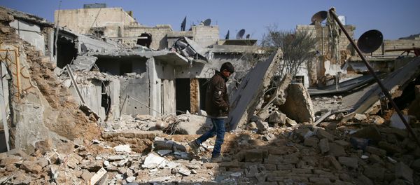 A boy walks on the rubble of damaged buildings in the rebel held besieged Douma neighbourhood of Damascus, Syria March 8, 2017 A boy walks on the rubble of damaged buildings in the rebel held besieged Douma neighbourhood of Damascus, Syria March 8, 2017 - Sputnik International