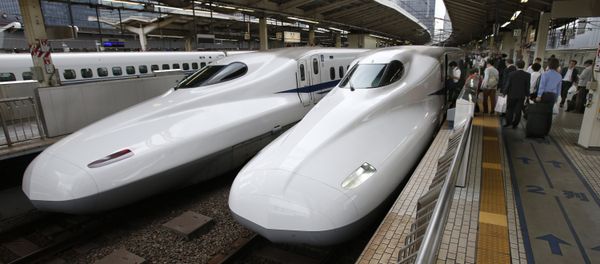 India's Prime Minister Narendra Modi (2nd R) and his Japanese counterpart Shinzo Abe (R) shake hands in front of a shinkansen train during their inspection at a bullet train manufacturing plant in Kobe, Hyogo prefecture on November 12, 2016 India's Prime Minister Narendra Modi (2nd R) and his Japanese counterpart Shinzo Abe (R) shake hands in front of a shinkansen train during their inspection at a bullet train manufacturing plant in Kobe, Hyogo prefecture on November 12, 2016 - Sputnik International