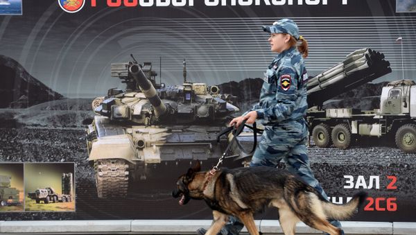 A police officer walks against a Rosobornexport banner at the Army 2016 International military and technical forum A police officer walks against a Rosobornexport banner at the Army 2016 International military and technical forum - Sputnik International