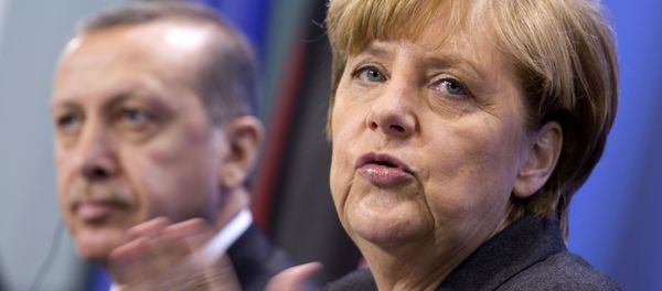 German Chancellor Angela Merkel, right, and Turkey's Prime Minister Recep Tayyip Erdogan, left (AP Photo/Axel Schmidt) German Chancellor Angela Merkel, right, and Turkey's Prime Minister Recep Tayyip Erdogan, left (AP Photo/Axel Schmidt) - Sputnik International