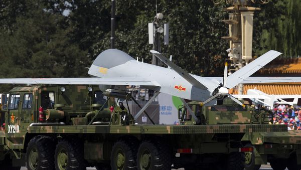A military vehicle carrying a Wing Loong, a Chinese made medium altitude long endurance unmanned aerial vehicle, drives past during a military parade at Tiananmen Square in Beijing (File) A military vehicle carrying a Wing Loong, a Chinese made medium altitude long endurance unmanned aerial vehicle, drives past during a military parade at Tiananmen Square in Beijing (File) - Sputnik International