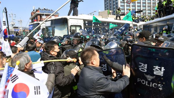 Protesters supporting South Korean President Park Geun-hye clash with riot policemen near the Constitutional Court in Seoul, South Korea, in this photo taken by Kyodo on March 10, 2017 Protesters supporting South Korean President Park Geun-hye clash with riot policemen near the Constitutional Court in Seoul, South Korea, in this photo taken by Kyodo on March 10, 2017 - Sputnik International