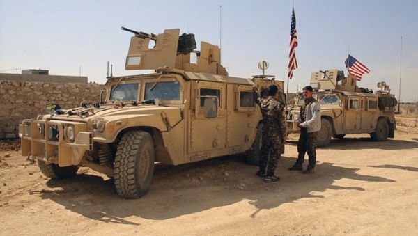 March 7, 2017 frame grab from video provided by Arab 24 network, shows fighters from the Syrian Democratic forces standing near U.S military vehicles on the outskirts of the Syrian town, Manbij, a flashpoint between Turkish troops and allied Syrian fighters and U.S.-backed Kurdish fighters, in al-Asaliyah village, Aleppo province, Syria - Sputnik International