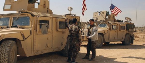 March 7, 2017 frame grab from video provided by Arab 24 network, shows fighters from the Syrian Democratic forces standing near U.S military vehicles on the outskirts of the Syrian town, Manbij, a flashpoint between Turkish troops and allied Syrian fighters and U.S.-backed Kurdish fighters, in al-Asaliyah village, Aleppo province, Syria - Sputnik International