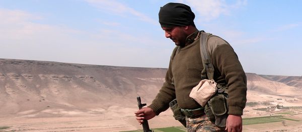 A Syrian Democratic Forces(SDF) fighter poses for a picture near Euphrates River, north of Raqqa city, Syria March 8, 2017 A Syrian Democratic Forces(SDF) fighter poses for a picture near Euphrates River, north of Raqqa city, Syria March 8, 2017 - Sputnik International