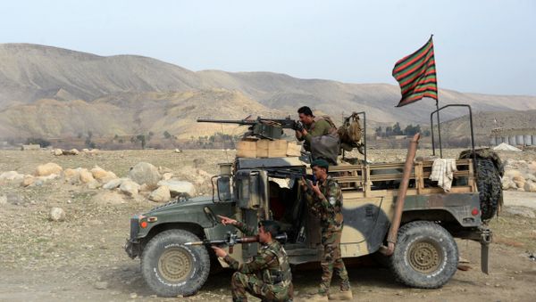 Afghan security force personnel look on from the shelter of a vehicle during an ongoing an operation against Islamic State (IS) militants in Kot district of Nangarhar province on February 16, 2017 Afghan security force personnel look on from the shelter of a vehicle during an ongoing an operation against Islamic State (IS) militants in Kot district of Nangarhar province on February 16, 2017 - Sputnik International