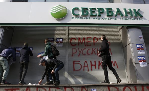 Radicals in front of a Sberbank branch in Kiev, putting up posters which read Attention! This is a bank of an aggressor country. It will be closed. Urgently withdraw your money!, during a protest. Graffiti reads Death to Russian banks. March 10, 2017 Radicals in front of a Sberbank branch in Kiev, putting up posters which read Attention! This is a bank of an aggressor country. It will be closed. Urgently withdraw your money!, during a protest. Graffiti reads Death to Russian banks. March 10, 2017 - Sputnik International