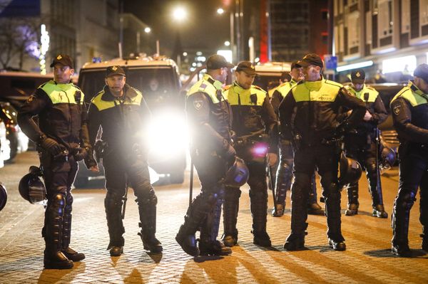 Members of the police stand in line during a gathering of demonstrators waving Turkish flags outside the Turkish consulate in Rotterdam, on 11 March 2017 after Netherlands refused Turkish Foreign Minister Mevlut Cavusoglu permission to land for a rally to gather support for a referendum on boosting Turkish president Erdogan's powers. - Sputnik International