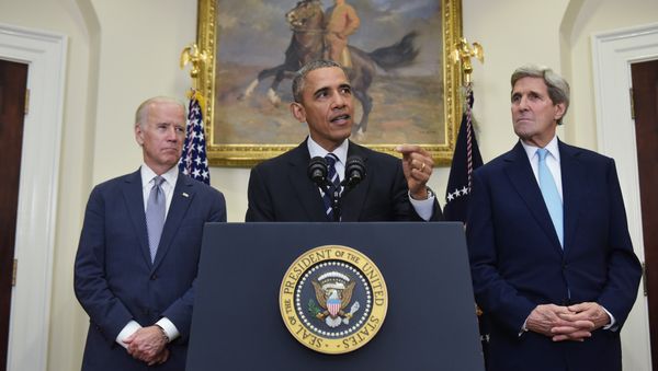 US President Barack Obama speaks on the Keystone XL pipeline, flanked by Secretary of State John Kerry (R), and Vice President Joe Biden, on November 6, 2015 in the Roosevelt Room of the White House in Washington, DC. - Sputnik International