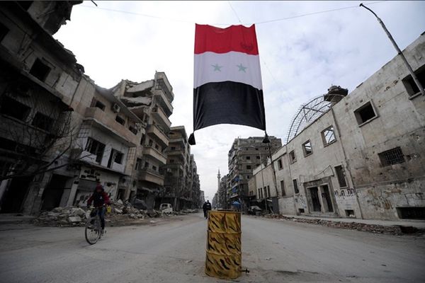 A Syrian national flag hangs in a damaged neighbourhood in Aleppo, Syria A Syrian national flag hangs in a damaged neighbourhood in Aleppo, Syria - Sputnik International
