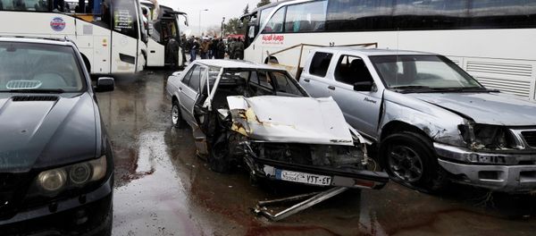 Damaged vehicles are pictured at the site of an attack by two suicide bombers in Damascus, Syria - Sputnik International