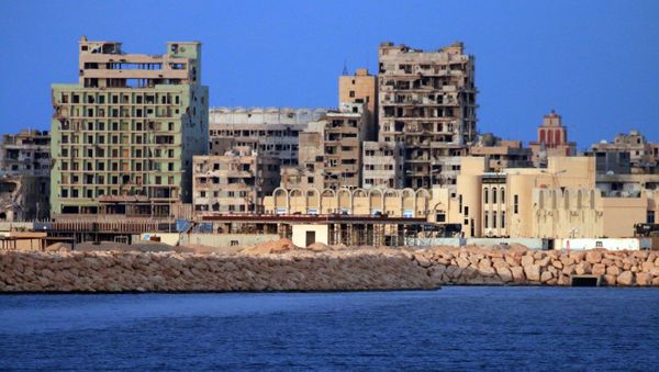 A picture taken on a boat of Libyan naval forces during a patrol shows a view of buildings, including abandoned Omar Khayyam hotel, in the port district in Libya's second city Benghazi on November 20, 2016 - Sputnik International