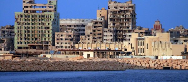 A picture taken on a boat of Libyan naval forces during a patrol shows a view of buildings, including abandoned Omar Khayyam hotel, in the port district in Libya's second city Benghazi on November 20, 2016 A picture taken on a boat of Libyan naval forces during a patrol shows a view of buildings, including abandoned Omar Khayyam hotel, in the port district in Libya's second city Benghazi on November 20, 2016 - Sputnik International