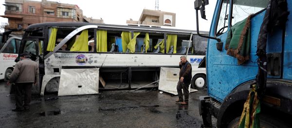 People inspect the damage at the site of an attack by two suicide bombers in Damascus, Syria People inspect the damage at the site of an attack by two suicide bombers in Damascus, Syria - Sputnik International