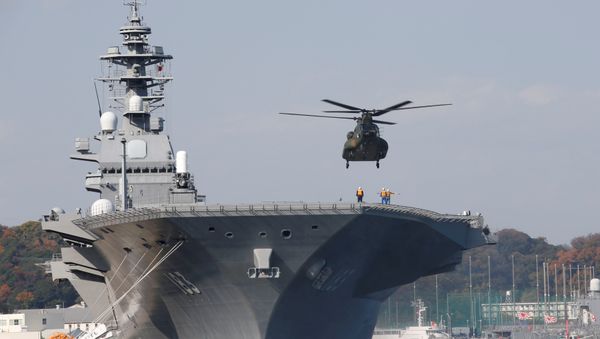 A helicopter lands on the Izumo, Japan Maritime Self Defense Force's (JMSDF) helicopter carrier, at JMSDF Yokosuka base in Yokosuka A helicopter lands on the Izumo, Japan Maritime Self Defense Force's (JMSDF) helicopter carrier, at JMSDF Yokosuka base in Yokosuka - Sputnik International