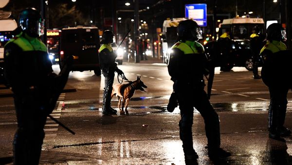 Riot police stand guard during clashes with demonstrators in the streets near the Turkish consulate in Rotterdam, Netherlands March 12, 2017. - Sputnik International