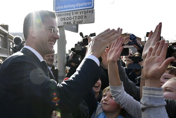 Dutch Prime Minister Mark Rutte gives 'high five' to children after casting his vote for the Dutch general election in The Hague, Netherlands, Wednesday, March 15, 2017 Dutch Prime Minister Mark Rutte gives 'high five' to children after casting his vote for the Dutch general election in The Hague, Netherlands, Wednesday, March 15, 2017 - Sputnik International