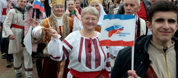 People attend a rally marking the third anniversary of Crimea voting to leave Ukraine and join the Russian state in central Simferopol on March 16, 2017 - Sputnik International