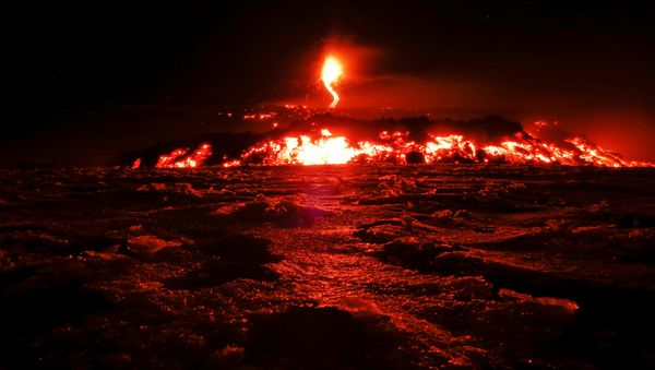 Italy's Mount Etna, Europe's tallest and most active volcano, spews lava as it erupts on the southern island of Sicily, Italy February 28, 2017 - Sputnik International