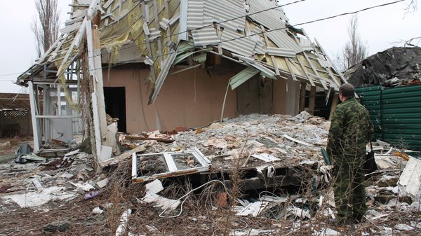A damaged building in the village of Spartak in the Donetsk Region, affected by shelling - Sputnik International