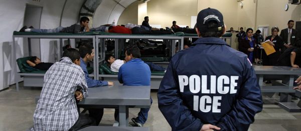 An Immigration and Customs Enforcement (ICE) officer guards a group of 116 Salvadorean immigrants that wait to be deported,at Willacy Detention facility in Raymondville, Texas on December 18, 2008 An Immigration and Customs Enforcement (ICE) officer guards a group of 116 Salvadorean immigrants that wait to be deported,at Willacy Detention facility in Raymondville, Texas on December 18, 2008 - Sputnik International