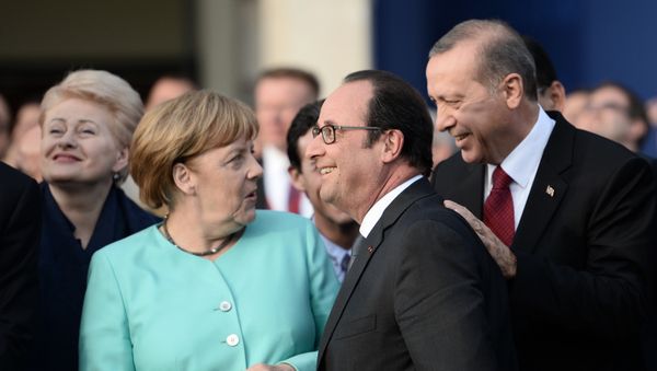 (L-R) German Chancellor Angela Merkel, French President Francois Hollande and Turkish President Recep Tayyip Erdogan share a smile as they attend the fly-past of NATO countries' jetfighters at the entrance of the National Stadium, the venue of the starting NATO summit, on July 8, 2016 (L-R) German Chancellor Angela Merkel, French President Francois Hollande and Turkish President Recep Tayyip Erdogan share a smile as they attend the fly-past of NATO countries' jetfighters at the entrance of the National Stadium, the venue of the starting NATO summit, on July 8, 2016 - Sputnik International