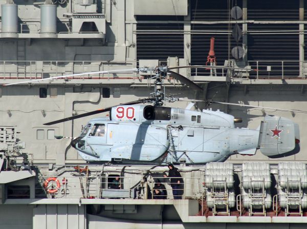 A Kamov Ka-31R Helix helicopter aboard the aircraft carrier Admiral Kuznetsov sails together with the Russian Northern Fleet's carrier battle group through the English Channel. File photo  - Sputnik International