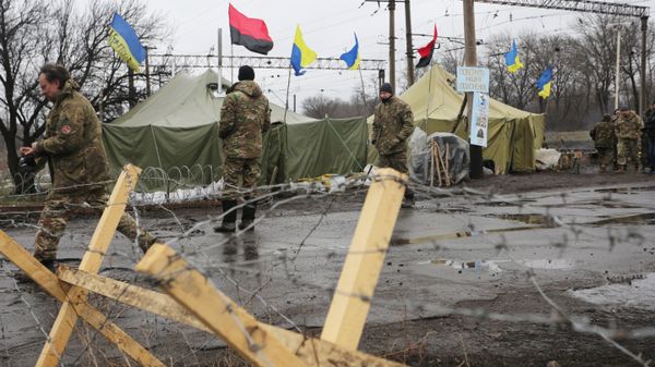 (File) Ukrainian nationalist protesters and military veterans take part in a blockade against ongoing trade with the Donbass self-proclaimed republics, on February 23, 2017, in Kryvyi Torets railway station, Donetsk region - Sputnik International