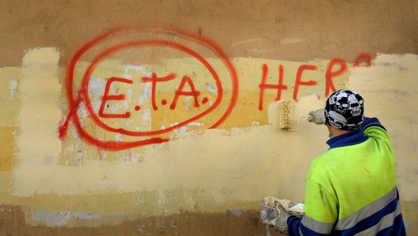 A municipal worker paints over graffiti reading ETA, The People Are With You in the Basque town of Guernica, Spain. A municipal worker paints over graffiti reading ETA, The People Are With You in the Basque town of Guernica, Spain. - Sputnik International