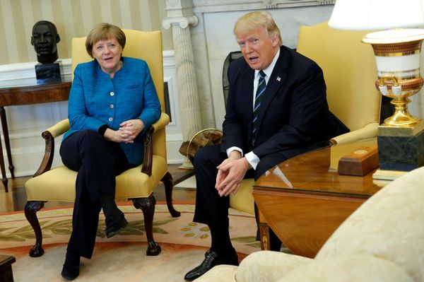 U.S. President Donald Trump and Germany's Chancellor Angela Merkel watch as reporters enter the room before their meeting in the Oval Office at the White House in Washington, U.S. March 17, 2017 - Sputnik International