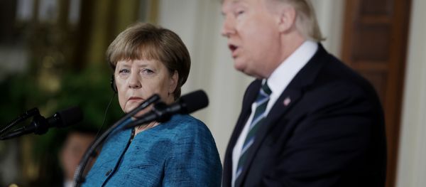 German Chancellor Angela Merkel listens as President Donald Trump speaks during their joint news conference in the East Room of the White House in Washington, Friday, March 17, 2017 German Chancellor Angela Merkel listens as President Donald Trump speaks during their joint news conference in the East Room of the White House in Washington, Friday, March 17, 2017 - Sputnik International