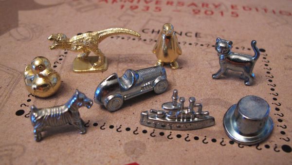 This March 15, 2017 photo shows the eight game tokens that will be included in upcoming versions of the Monopoly board game, in Atlantic City, N.J. Hasbro Inc. revealed the results of voting on Friday, March 17, 2017. Leaving the game will be the boot, wheelbarrow and thimble tokens, replaced by a ducky, T-Rex dinosaur and a penguin. - Sputnik International