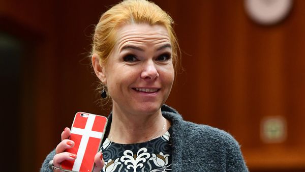 Danish Interior Minister Inger Stojberg holds her phone showing a Danish flags as she attends a Justice and Home Affairs Council at the European Council in Brussels on November 18, 2016 Danish Interior Minister Inger Stojberg holds her phone showing a Danish flags as she attends a Justice and Home Affairs Council at the European Council in Brussels on November 18, 2016 - Sputnik International