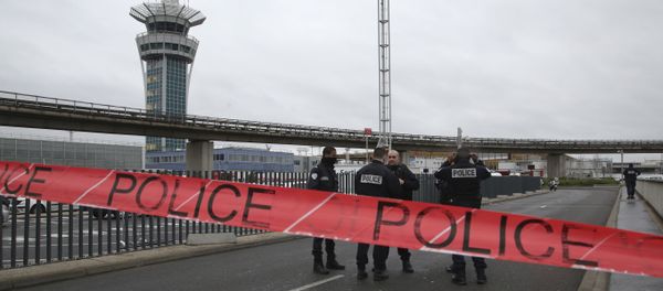 Police officers cordon off the access to the Orly airport, south of Paris, Saturday, March, 18, 2017. A man was shot to death Saturday after trying to seize the weapon of a soldier guarding Paris' Orly Airport, prompting a partial evacuation of the terminal, police said. Authorities warned visitors to avoid the area while an ongoing police operation was underway. - Sputnik International