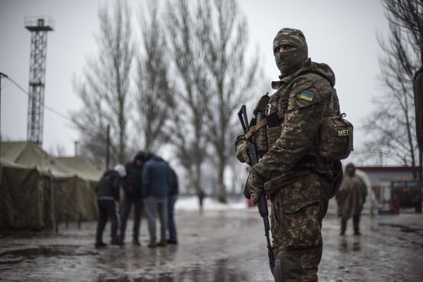 A Ukrainian serviceman patrols at the humanitarian aid center in Avdiivka, Ukraine, Saturday, Feb. 4, 2017 A Ukrainian serviceman patrols at the humanitarian aid center in Avdiivka, Ukraine, Saturday, Feb. 4, 2017 - Sputnik International