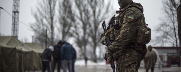 A Ukrainian serviceman patrols at the humanitarian aid center in Avdiivka, Ukraine, Saturday, Feb. 4, 2017 A Ukrainian serviceman patrols at the humanitarian aid center in Avdiivka, Ukraine, Saturday, Feb. 4, 2017 - Sputnik International
