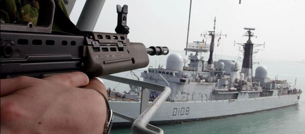 A UK Marine stands guard aboard the Royal Fleet Auxiliary forward repair ship Diligence ducked near to UK Royal Navy's destroyer Cardiff D108 A UK Marine stands guard aboard the Royal Fleet Auxiliary forward repair ship Diligence ducked near to UK Royal Navy's destroyer Cardiff D108 - Sputnik International