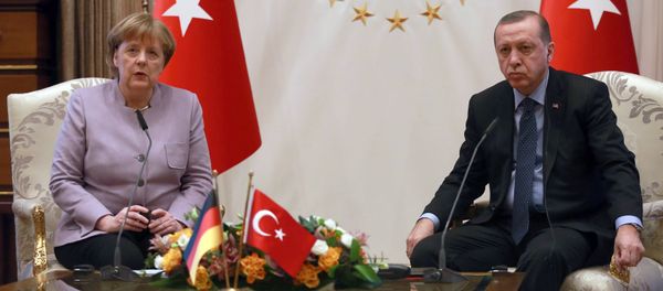 Turkish President Recep Tayyip Erdogan (R) listens on as German Chancellor Angela Merkel speaks during their meeting at the Presidential Palace on February 2, 2017 in Ankara Turkish President Recep Tayyip Erdogan (R) listens on as German Chancellor Angela Merkel speaks during their meeting at the Presidential Palace on February 2, 2017 in Ankara - Sputnik International