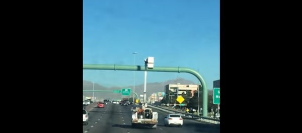 Utility Trucker Drives with Bucket Up Utility Trucker Drives with Bucket Up - Sputnik International