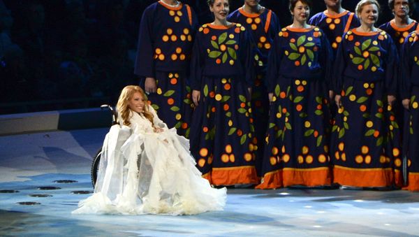FILE In this Friday, March 7, 2014 file photo, Yulia Samoylova sits on stage during the opening ceremony of the 2014 Paralympic Games in Sochi, Russia. - Sputnik International