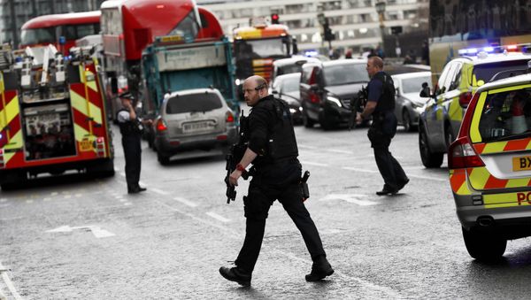 Armed police respond outside Parliament during an incident on Westminster Bridge in London, Britain Armed police respond outside Parliament during an incident on Westminster Bridge in London, Britain - Sputnik International