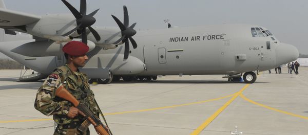 An Indian soldier stands guard in front of the first of the six C-130J Super Hercules, a US military aircraft manufactured by Lockheed Martin. (File) An Indian soldier stands guard in front of the first of the six C-130J Super Hercules, a US military aircraft manufactured by Lockheed Martin. (File) - Sputnik International