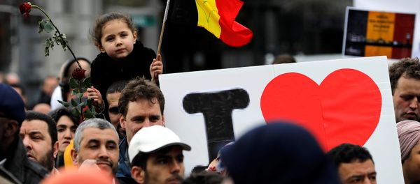 People take part in a march in front of the Brussels Stock Exchange, La Bourse, as part of ceremonies commemorating the first anniversary of twin attacks at Brussels airport and a metro train, Belgium, March 22, 2017. People take part in a march in front of the Brussels Stock Exchange, La Bourse, as part of ceremonies commemorating the first anniversary of twin attacks at Brussels airport and a metro train, Belgium, March 22, 2017. - Sputnik International