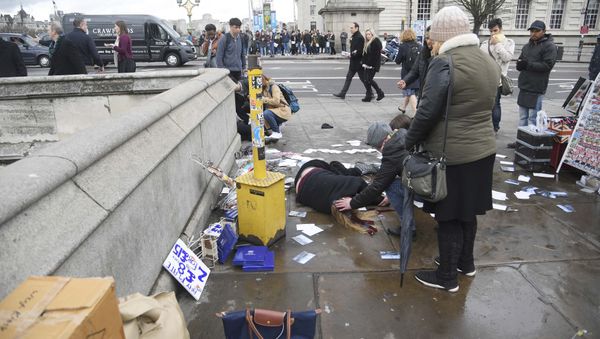 Injured people are assisted after an incident on Westminster Bridge in London, Britain Injured people are assisted after an incident on Westminster Bridge in London, Britain - Sputnik International
