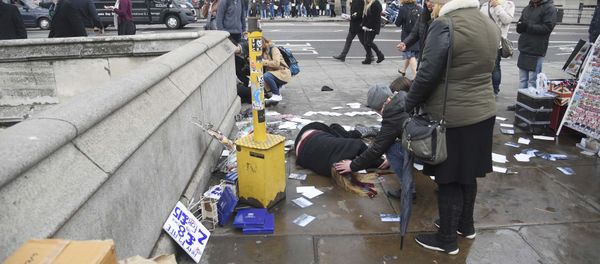 Injured people are assisted after an incident on Westminster Bridge in London, Britain Injured people are assisted after an incident on Westminster Bridge in London, Britain - Sputnik International