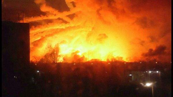 Smoke rises over a warehouse storing tank ammunition at a military base in the town of Balaklia (Balakleya), Kharkiv region, Ukraine, March 23, 2017. - Sputnik International